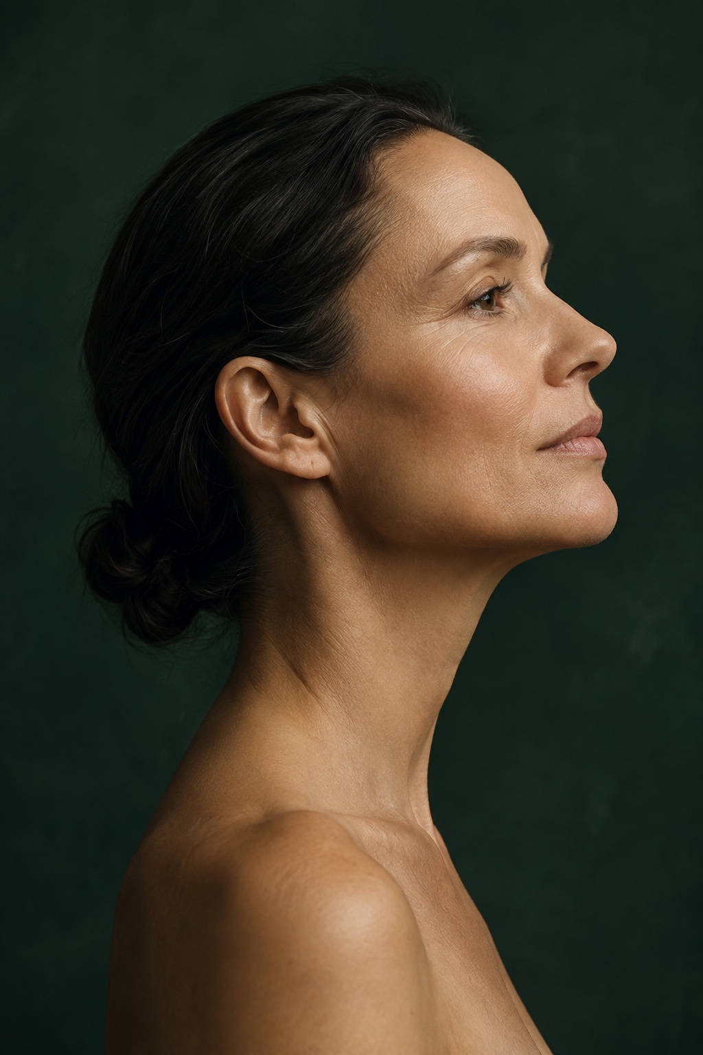 Calm editorial profile portrait in soft green light