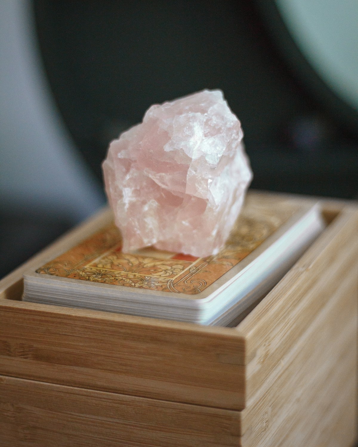 Rose quartz roller on a marble surface