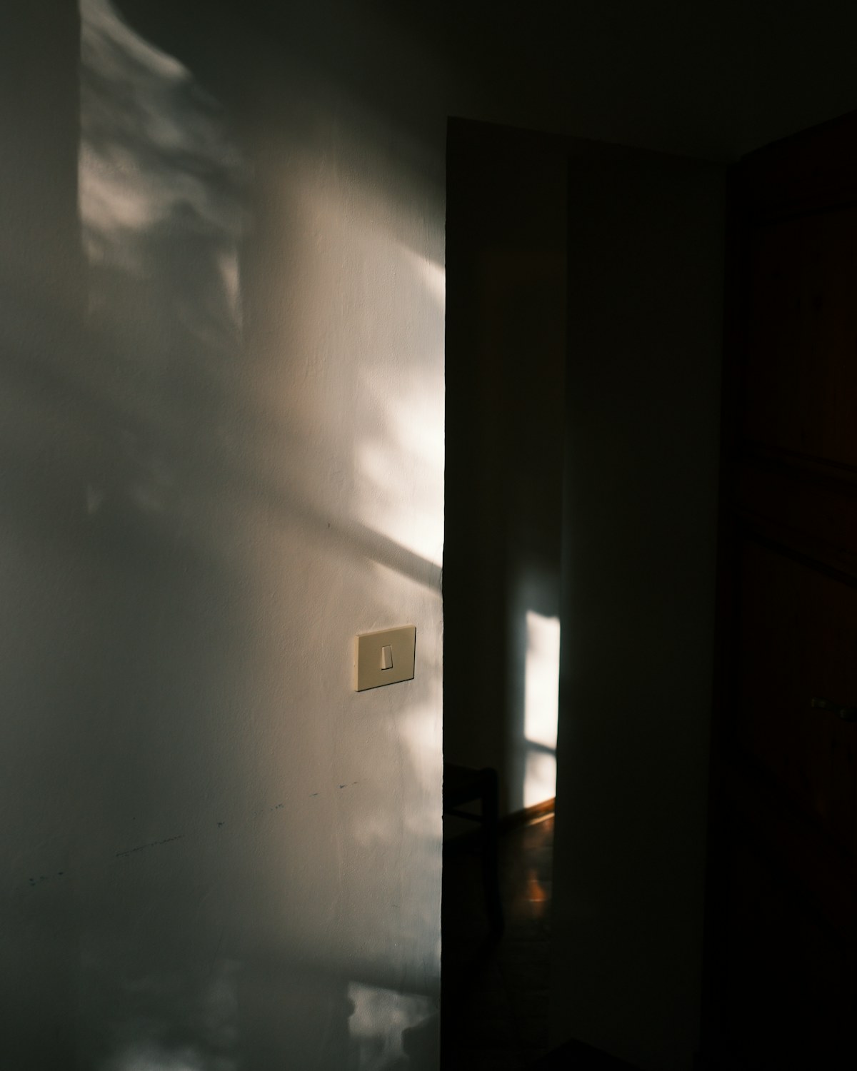 Sunlit doorway with a linen curtain