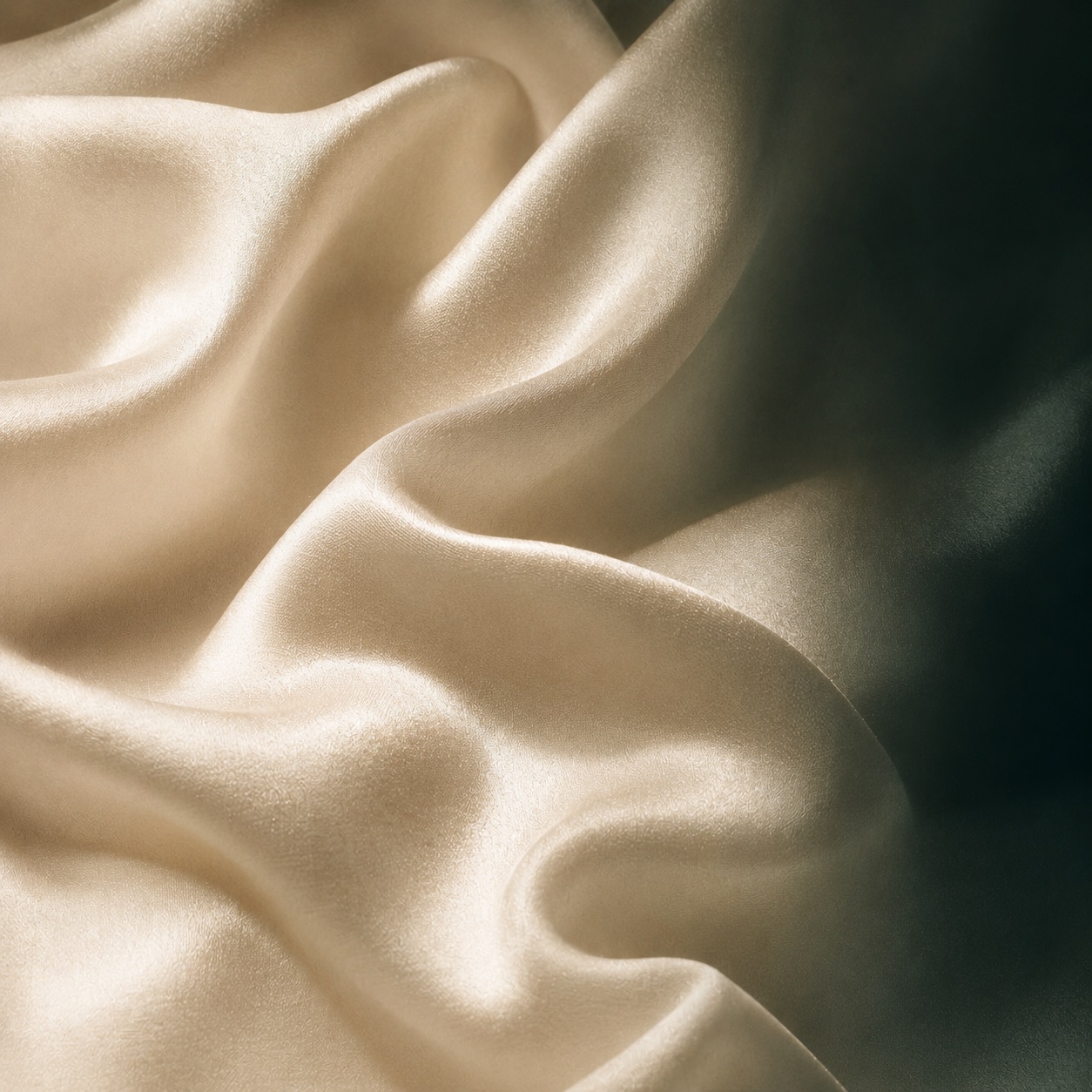 Draped cream silk fabric in close view